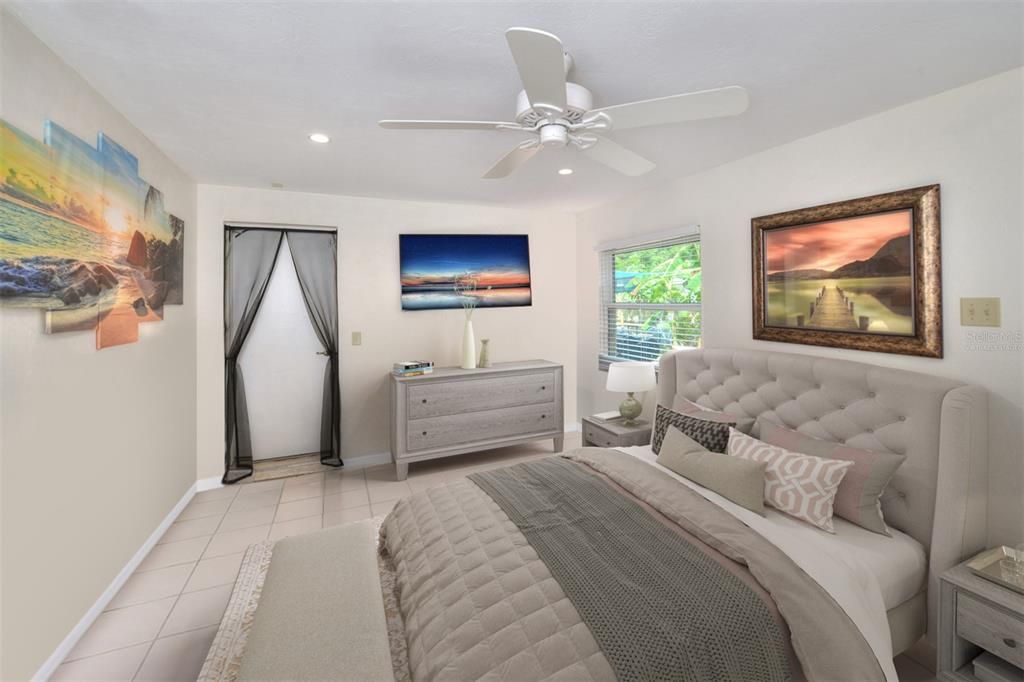 3rd Bedroom with private entry from garage - 3rd bdrm furniture has been virtually staged