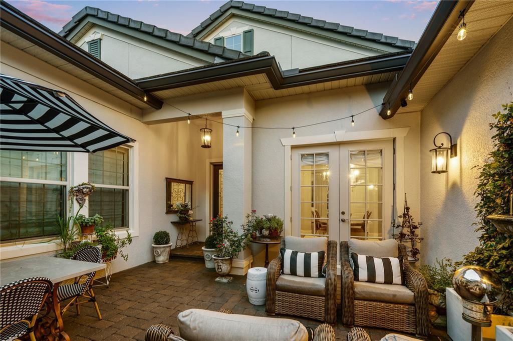 Enter through a private open-air walled courtyard with water feature, pavers & black iron gate and you’ll be charmed by an unmistakable French Parisian style.