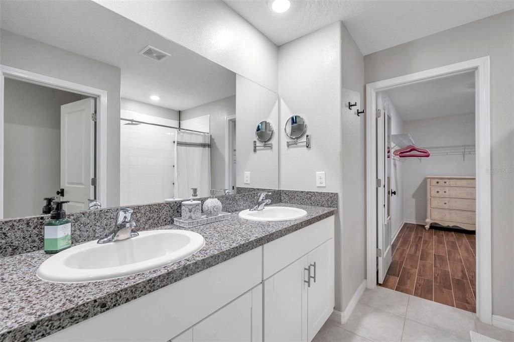 Master bathroom with large walk-in closet