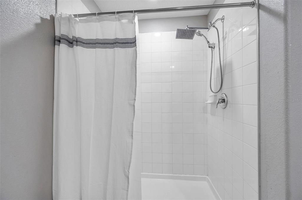 Master bathroom with large walk-in closet