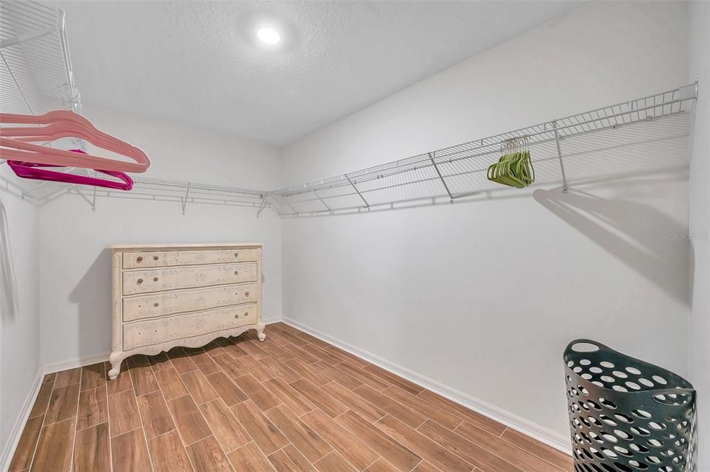 Master bathroom with large walk-in closet