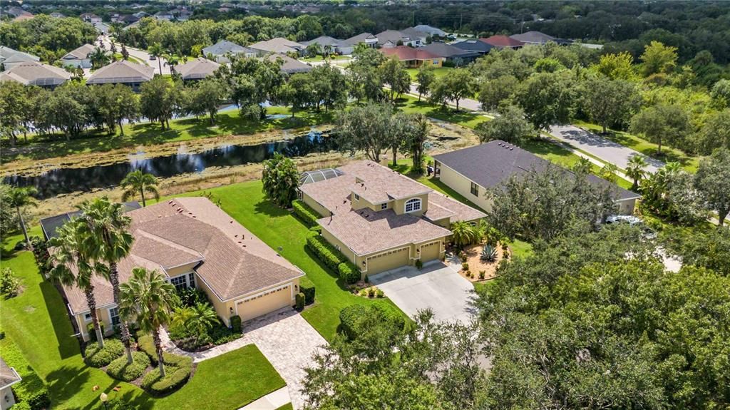 Well maintained lot facing north in the highly desirable community of Greyhawk Landing with a lake view behind the home as well as a nature preserve in front, truly enhancing the Florida tropical ambiance of this home