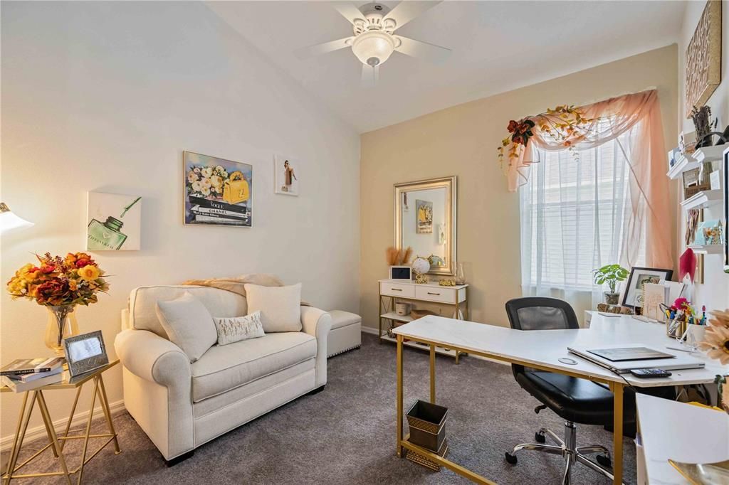 Second bedroom with ceiling fan, carpet flooring and plentiful storage closet.