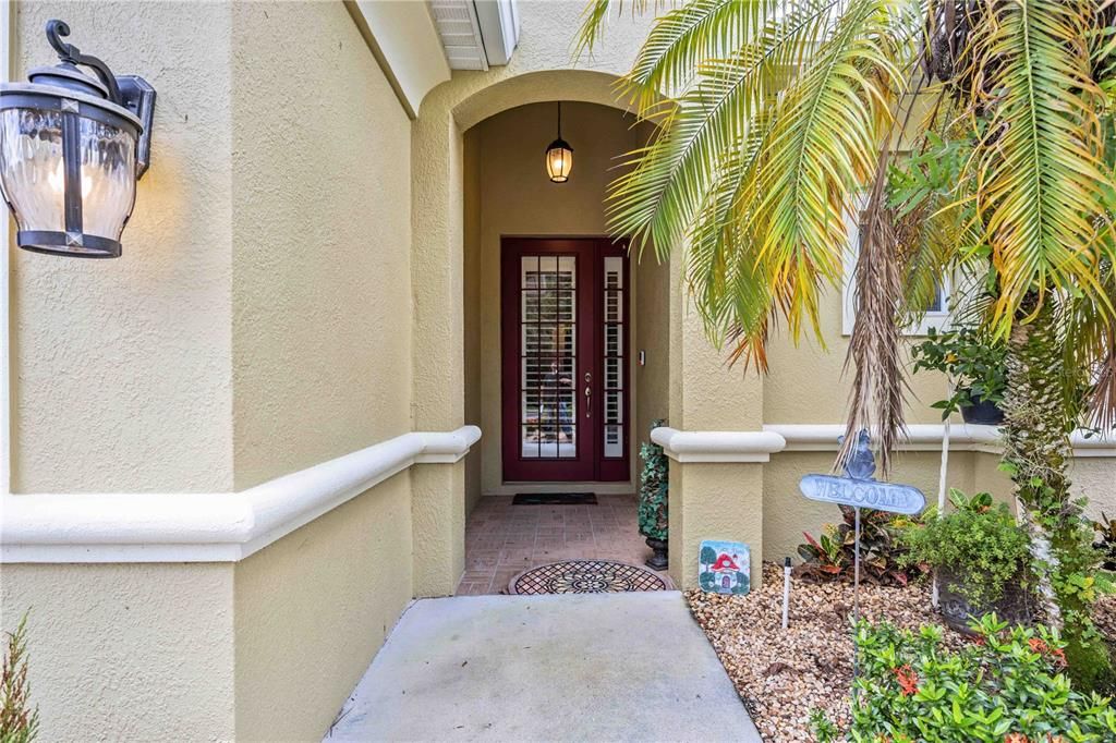 Warm and welcoming covered front entrance leading into the impressive foyer