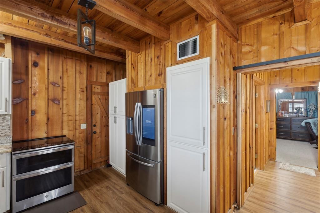 Kitchen showing that it leads to bedroom 2 / full bathroom as well