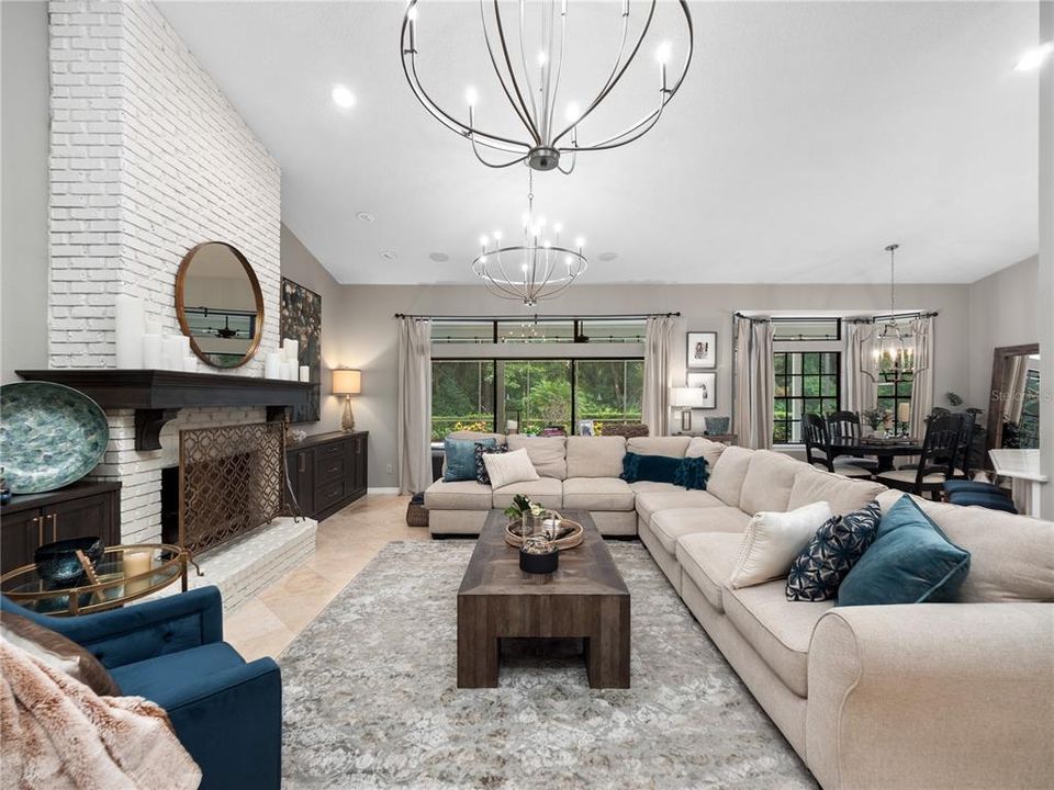 Beautiful built-ins and painted brick wood burning fireplace.