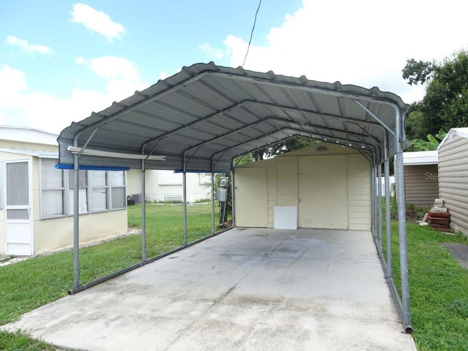 Car Port with shed and pump house