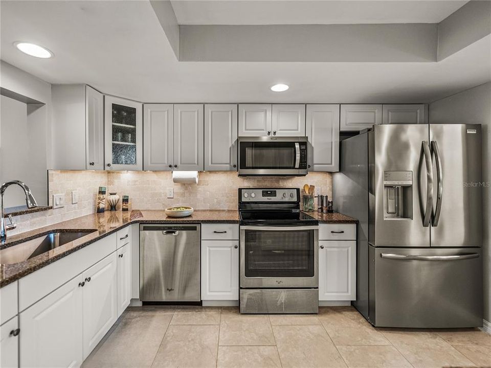 Kitchen updated with granite countertops, solid wood & soft close cabinets, stainless appliances~