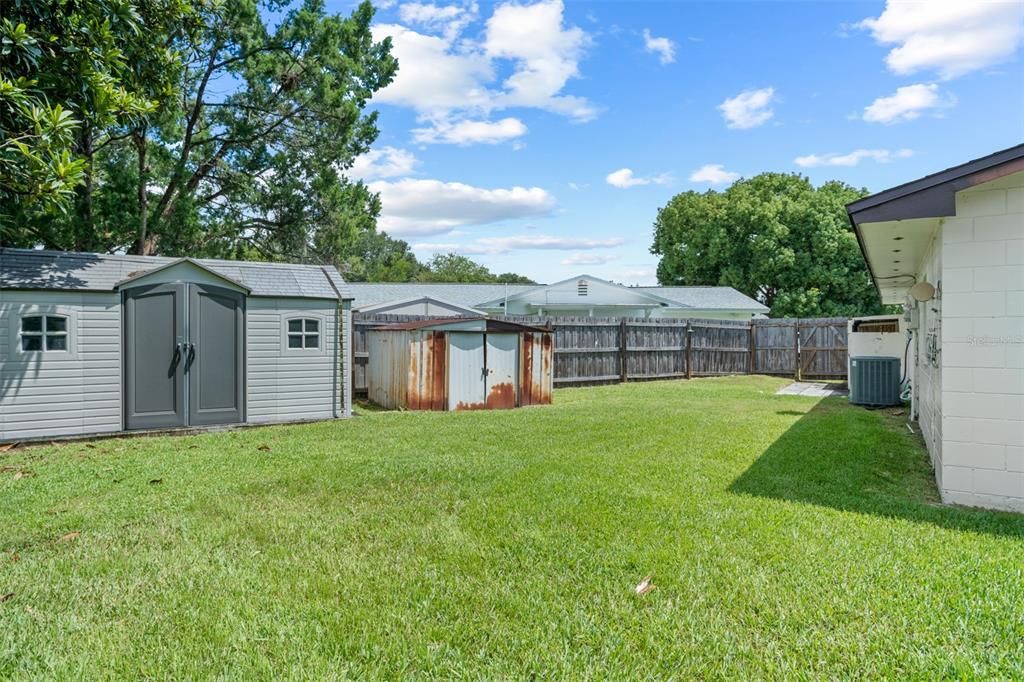 Fenced in yard with extra storage