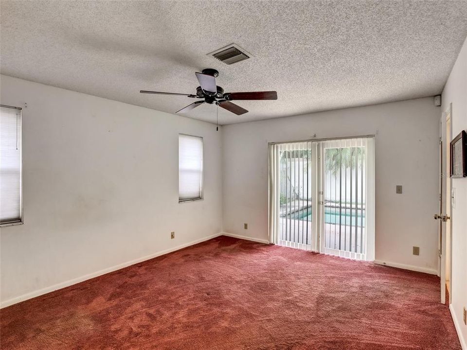 Primary Bedroom with French Doors to Pool area