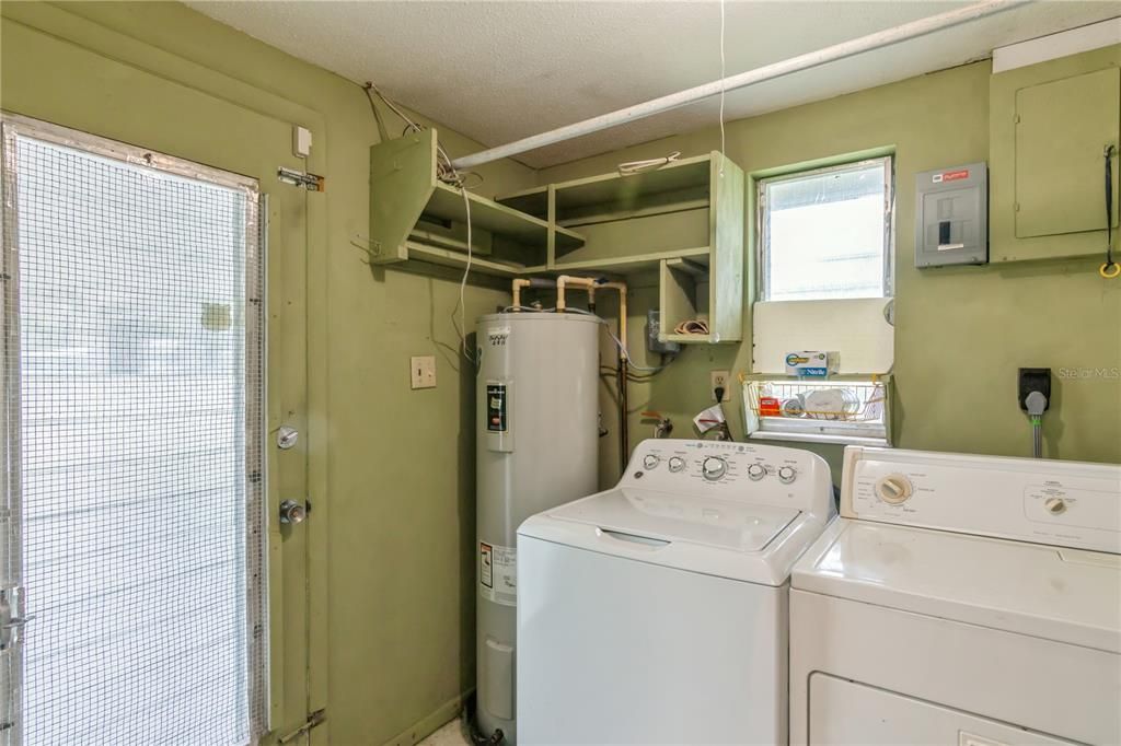 Laundry Room Located off of Kitchen. With Separate outside access from Carport.  Not under A/C