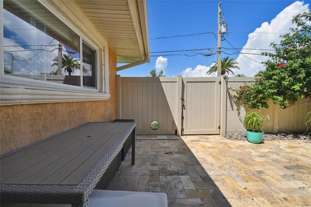 patio off the family room with gate, and doggie window.