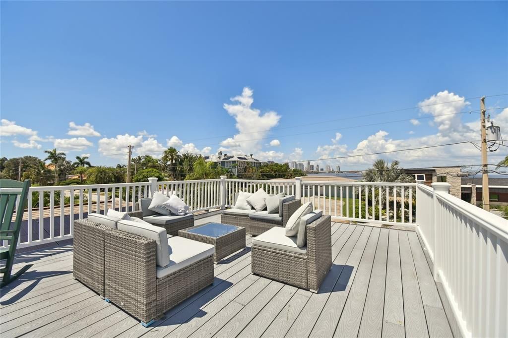 Giant deck looking to water from 3 sides, see Downtown St Pete in background.  We're not on the water but across the street from the way, less expenses but still great views.