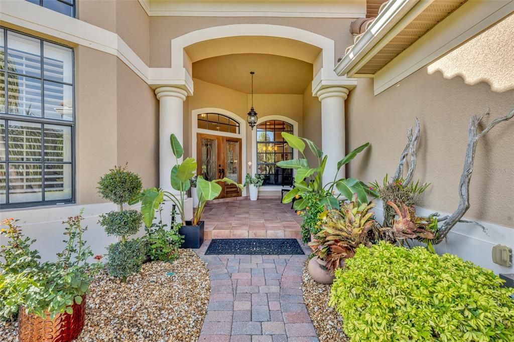 Beautiful walkway with double custom entry doors