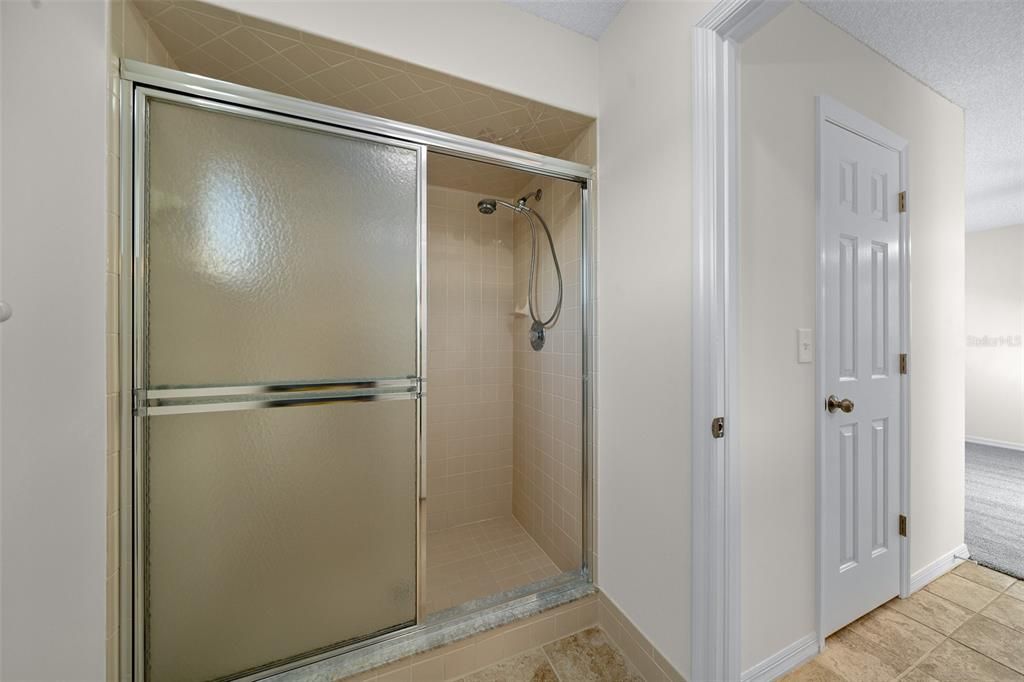 Linen closet in shower/toilet area.