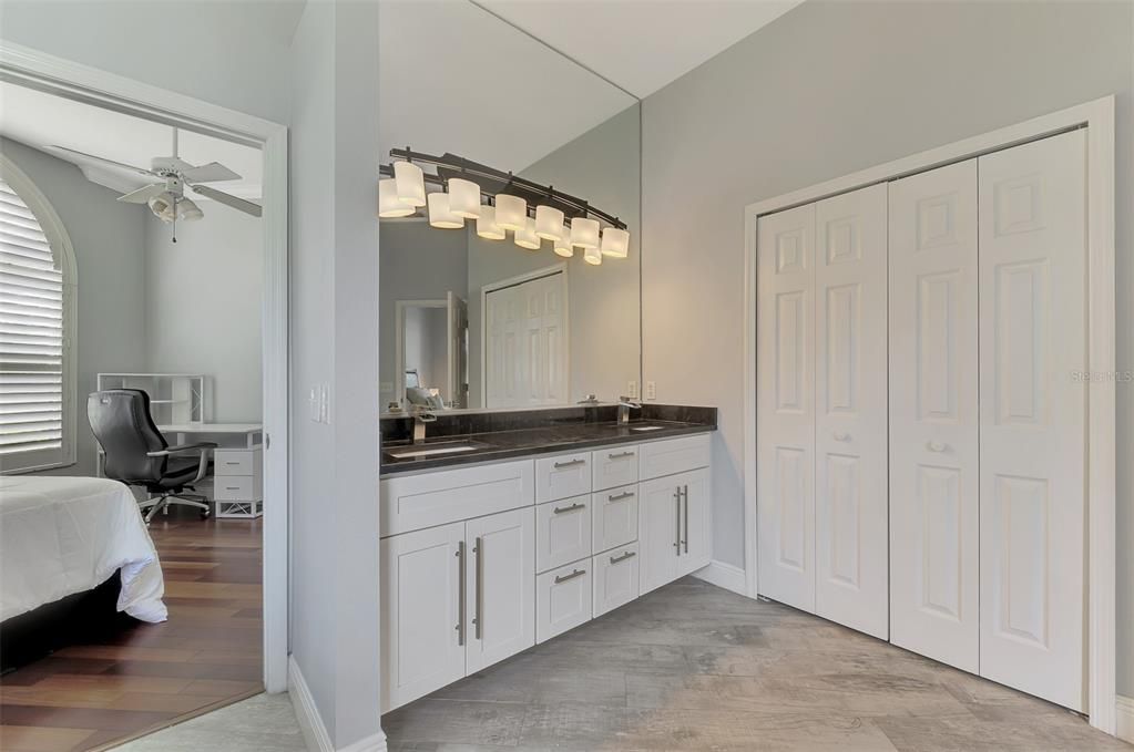 Double sink vanity. Out the door is the den, which is currently being used as a 4th bedroom.