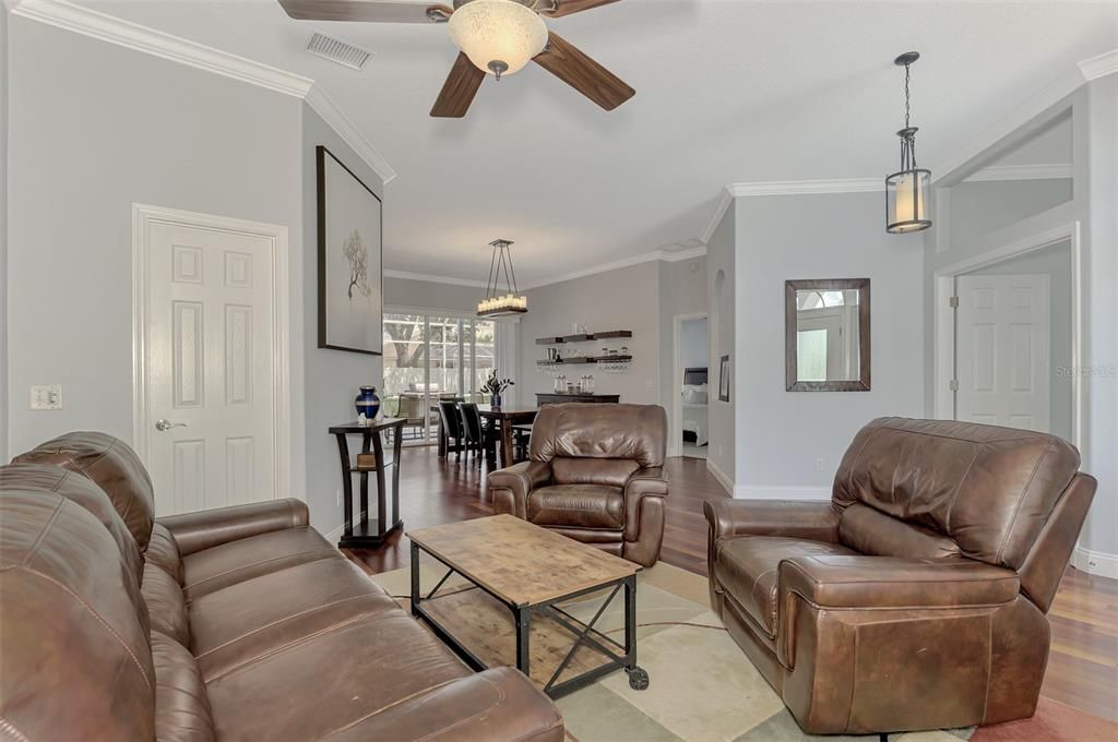 Living area connecting to formal dining area.