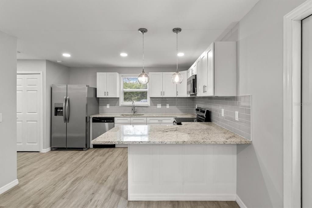 Breakfast Bar...Hallway w/ Laundry Closet on Left