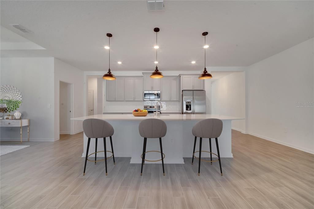 Kitchen with Seating (virtually staged)