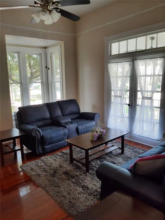 Living Room with Decorative Historic Fireplace