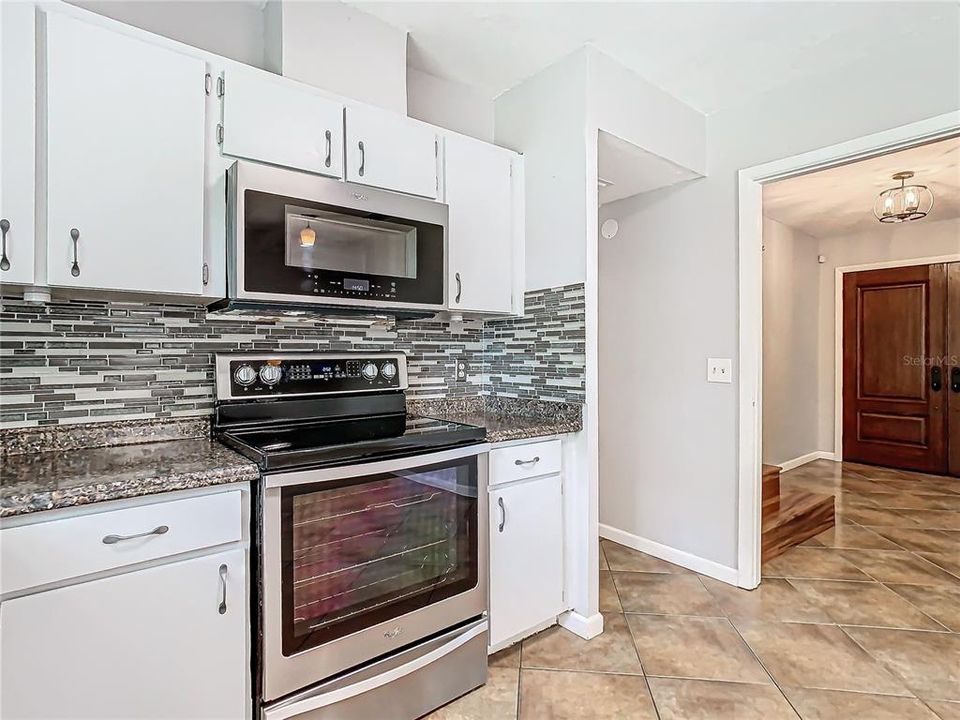 Kitchen looking towards foyer & stairway