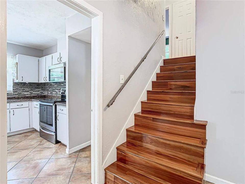 Foyer looking towards kitchen and stairway