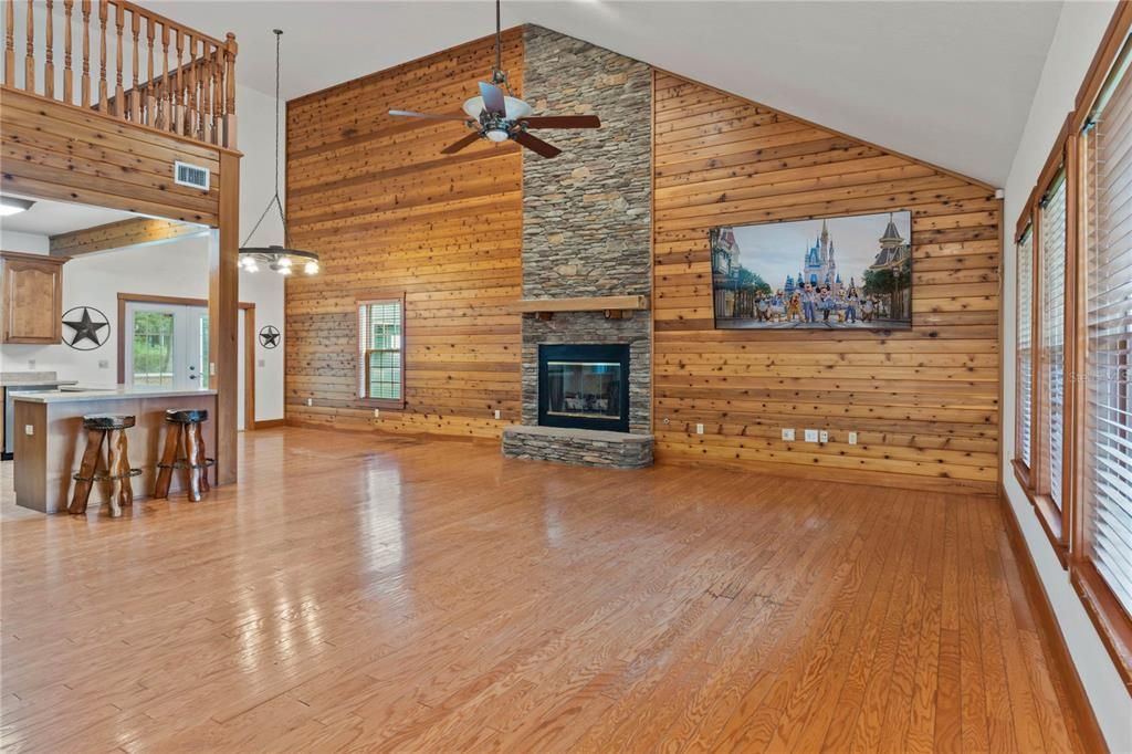 Cathedral ceiling with cedar wall and stackstone fireplace