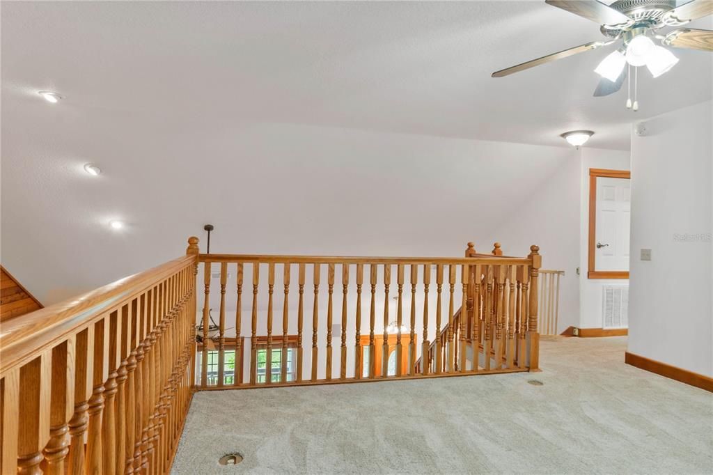 Upstairs loft looks down over living area...