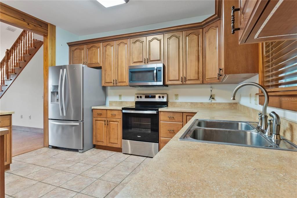 Stainless steel appliances in this Custom kitchen