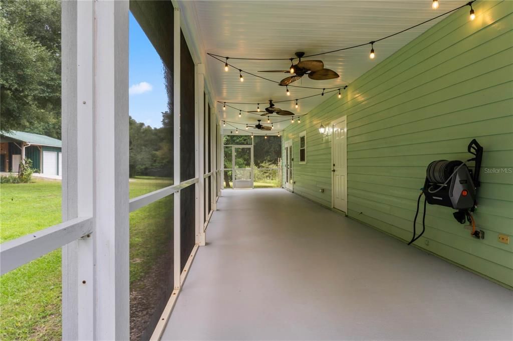 Screened  back porch with Edison lights is a GREAT space!