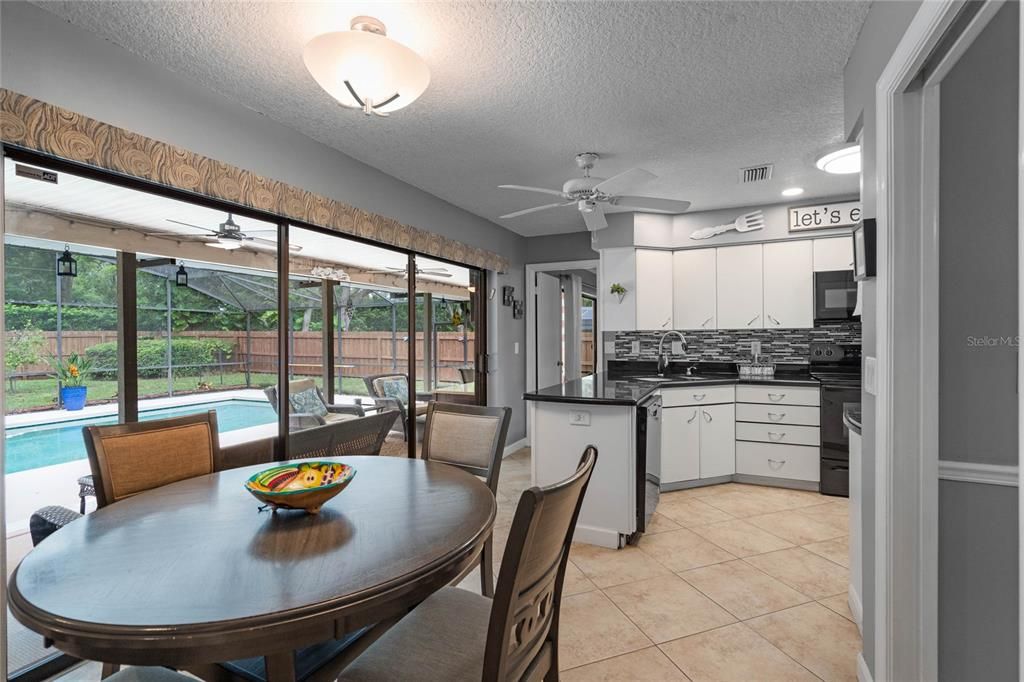 The breakfast nook has a great view overlooking the pool and lanai