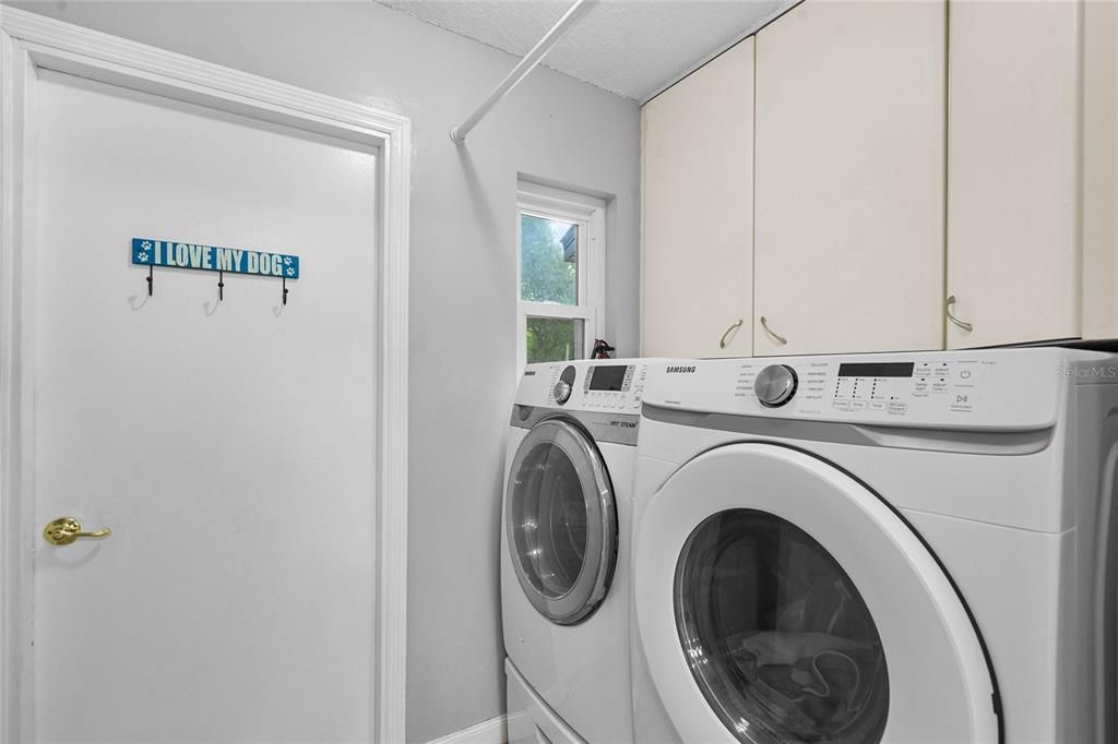 Laundry room with built-in cabinets