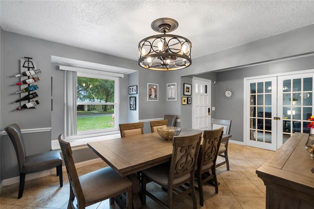 Dining Room has ample room for a large table and additional furniture. Note the window seat and the Fandelier (a ceiling fan and a chandelier combined into one fixture)