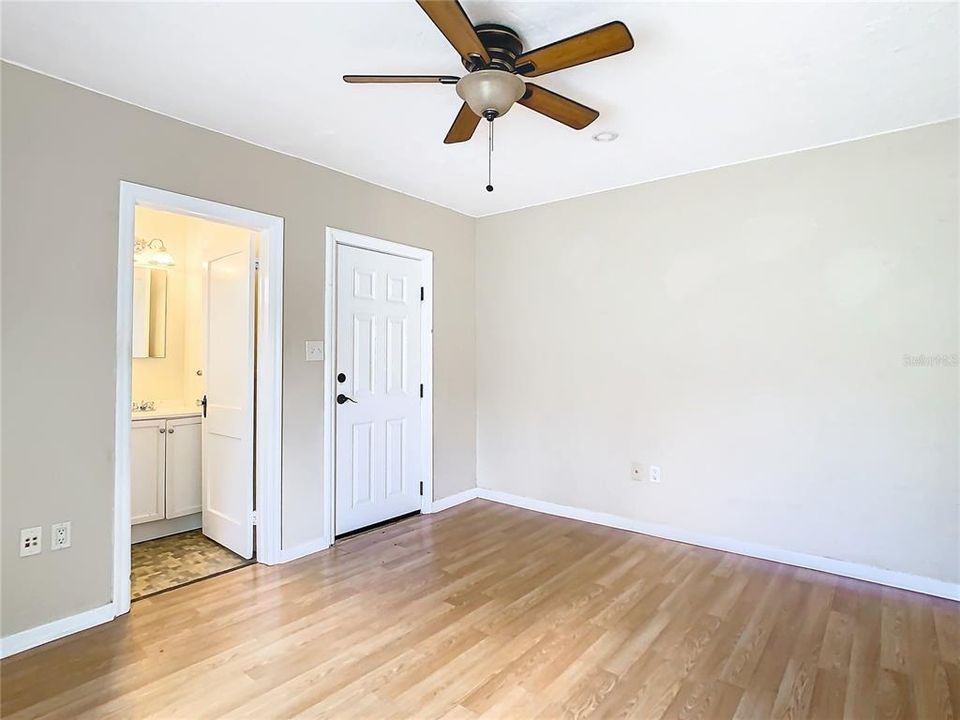 ADU Guest Cottage with door leading to bathroom and exit door leading to the west side of the property