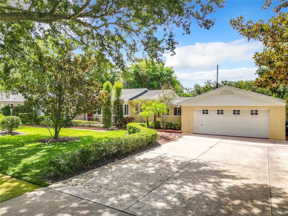 Two Car garage and parking pad to the right