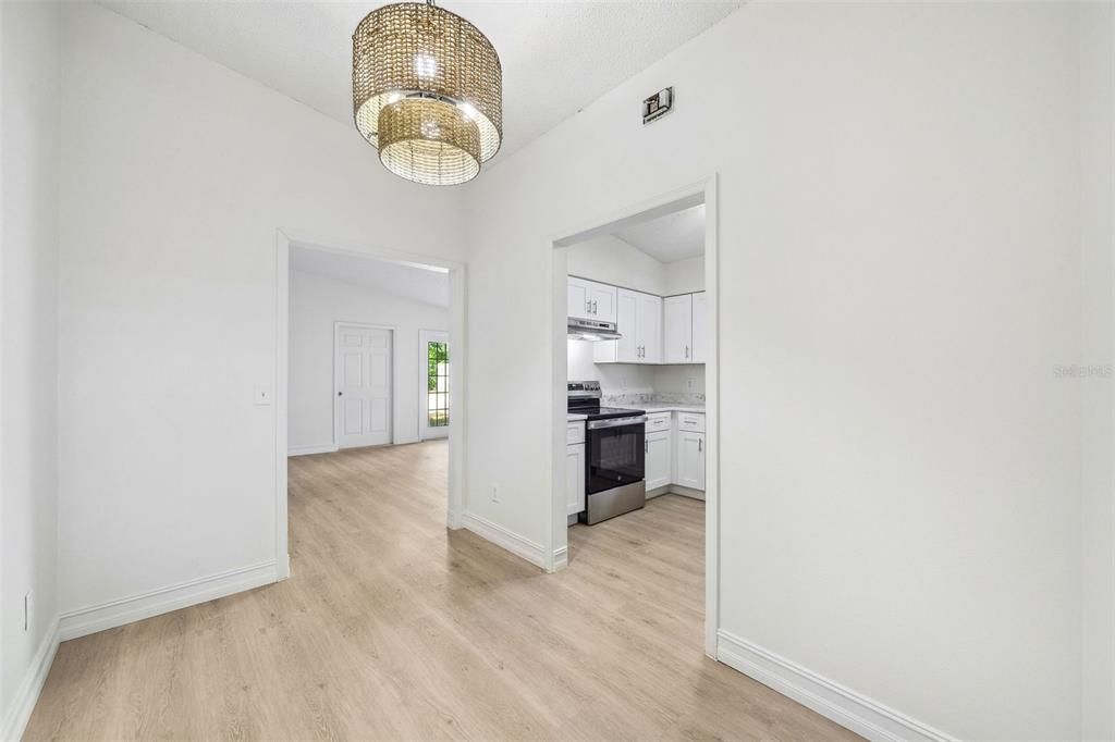 Dining area looking into kitchen and living room.