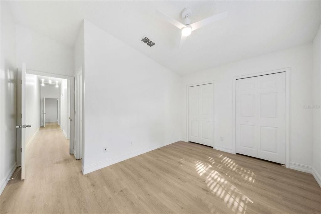 Primary bedroom with double closets.