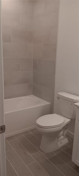 Tiled shower in guest baths