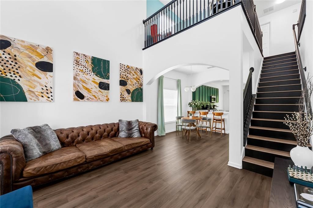 Upon entering, cathedral ceiling over the living room and stairway up to loft area and secondary bedrooms, laundry and bathroom.