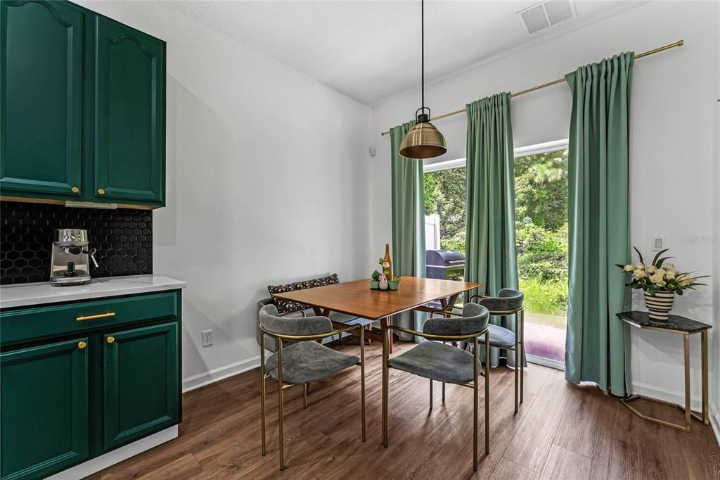 Eat in kitchen area that leads to the back patio with conservation view.