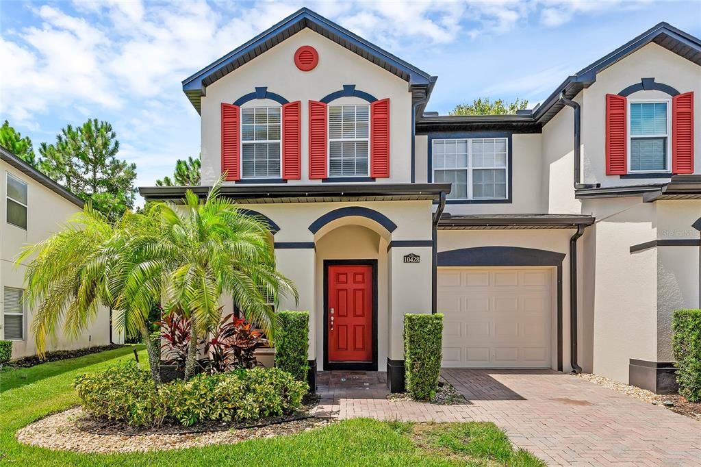 Front of end unit townhome with covered front porch and spacious single car garage.