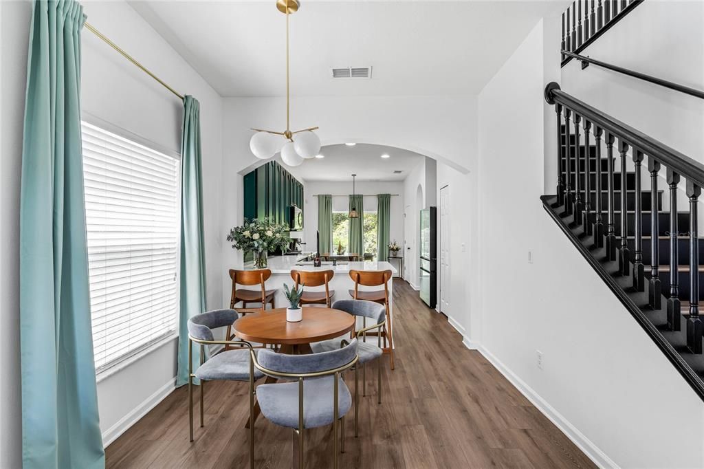 Dining area leading into the kitchen.