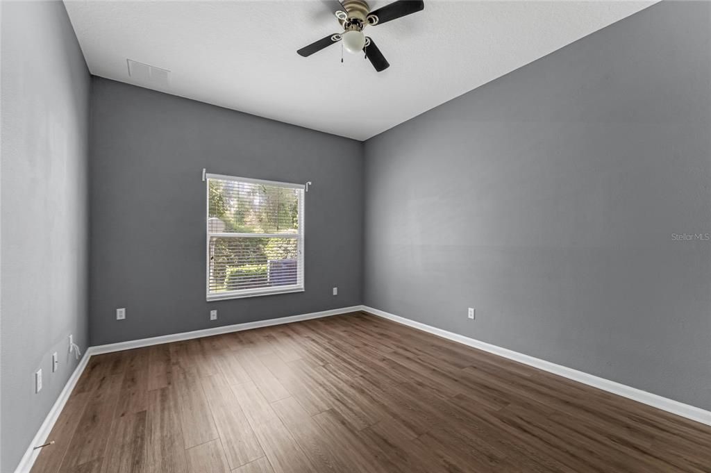 Primary bedroom located off of the kitchen.