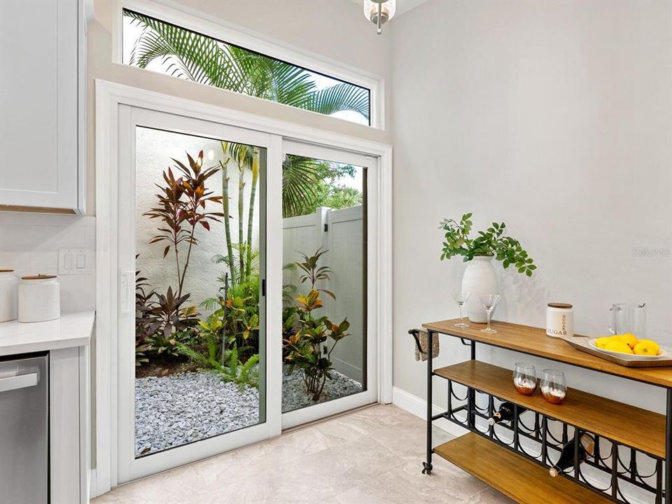 Breakfast nook in kitchen overlooking atrium