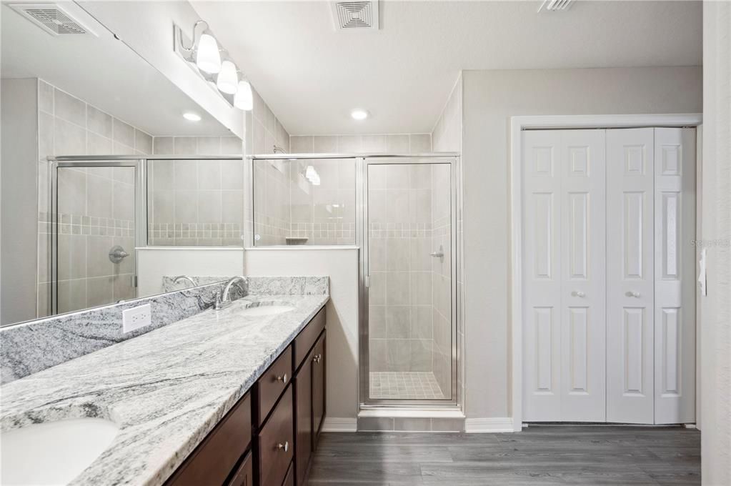 Master Bath, just off Master Bedroom, with large walk in shower. 1 of 2 Master walk in closets in photo