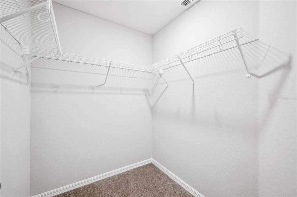 Walk in closet 1 of 2 in Primary Bedroom Suite