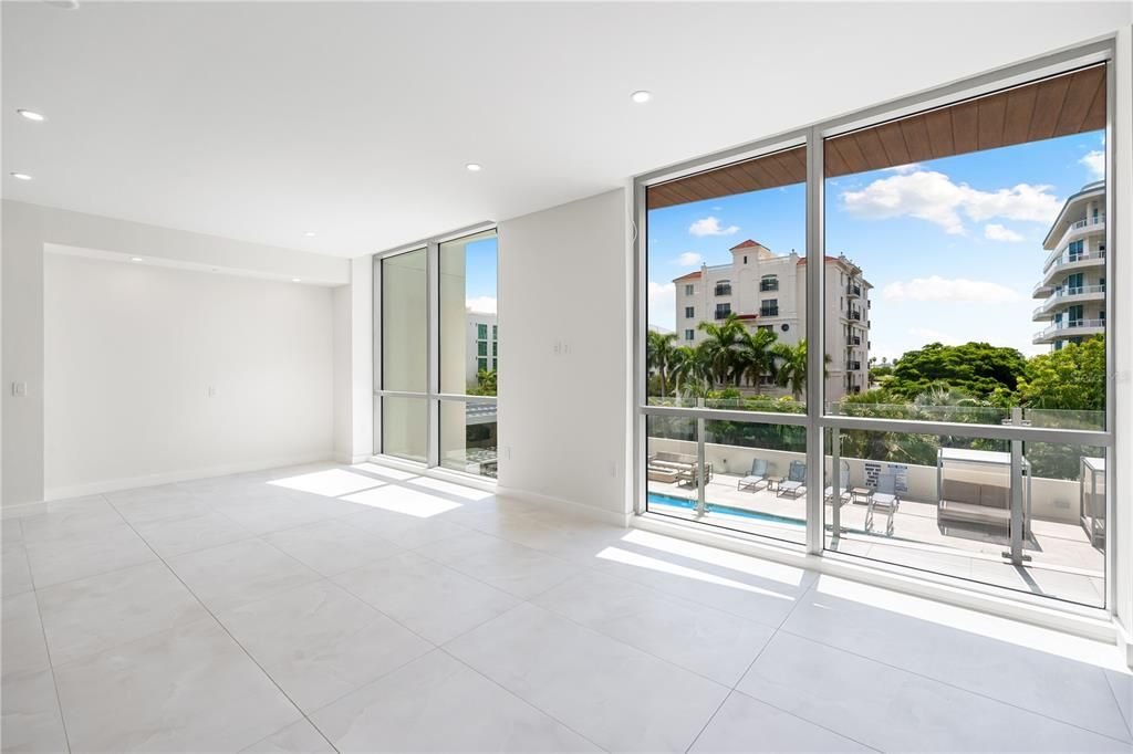 Living Room with views overlooking the pool and tropical view of Golden Gate Point