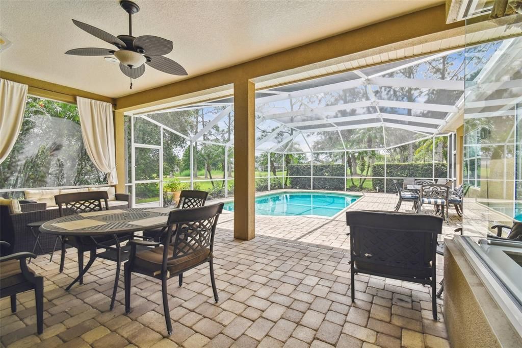 Multiple seating areas both covered and uncovered in Pool area