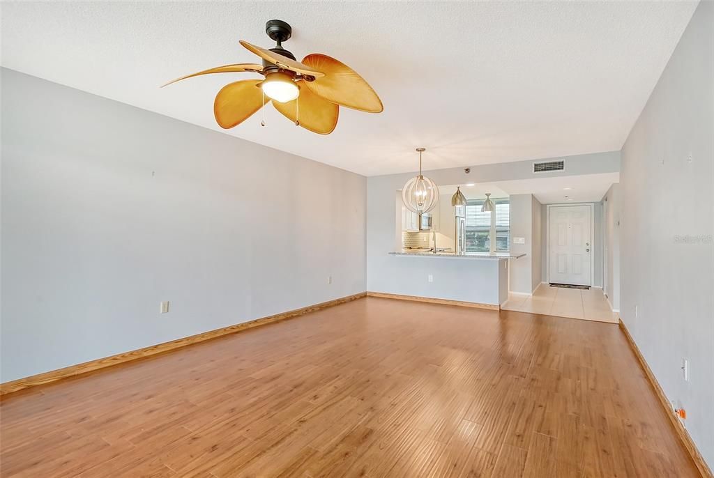 Living room looking toward kitchen and foyer at entry