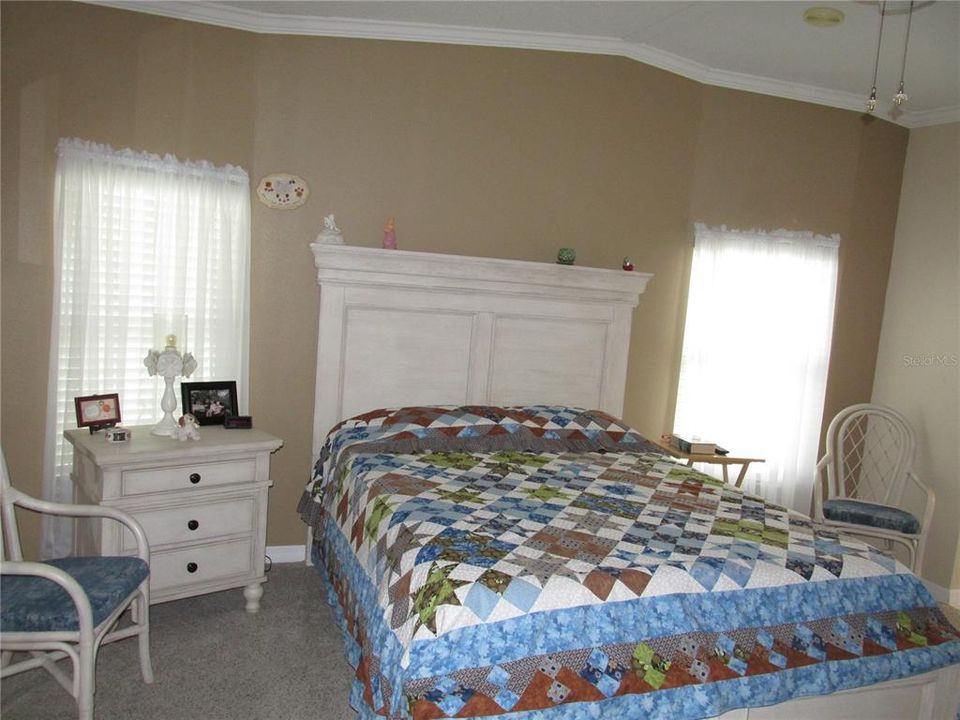 Master King Size Bedroom with a large walk-in closet and private bath area. Two sinks and separate room for Shower and commode.